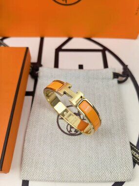Hermès Clic H Bracelet – Classic Orange Enamel with Gold Clasp